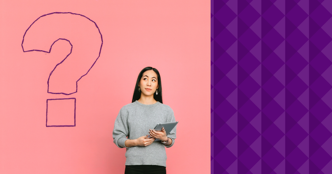 A woman standing next to a giant question mark