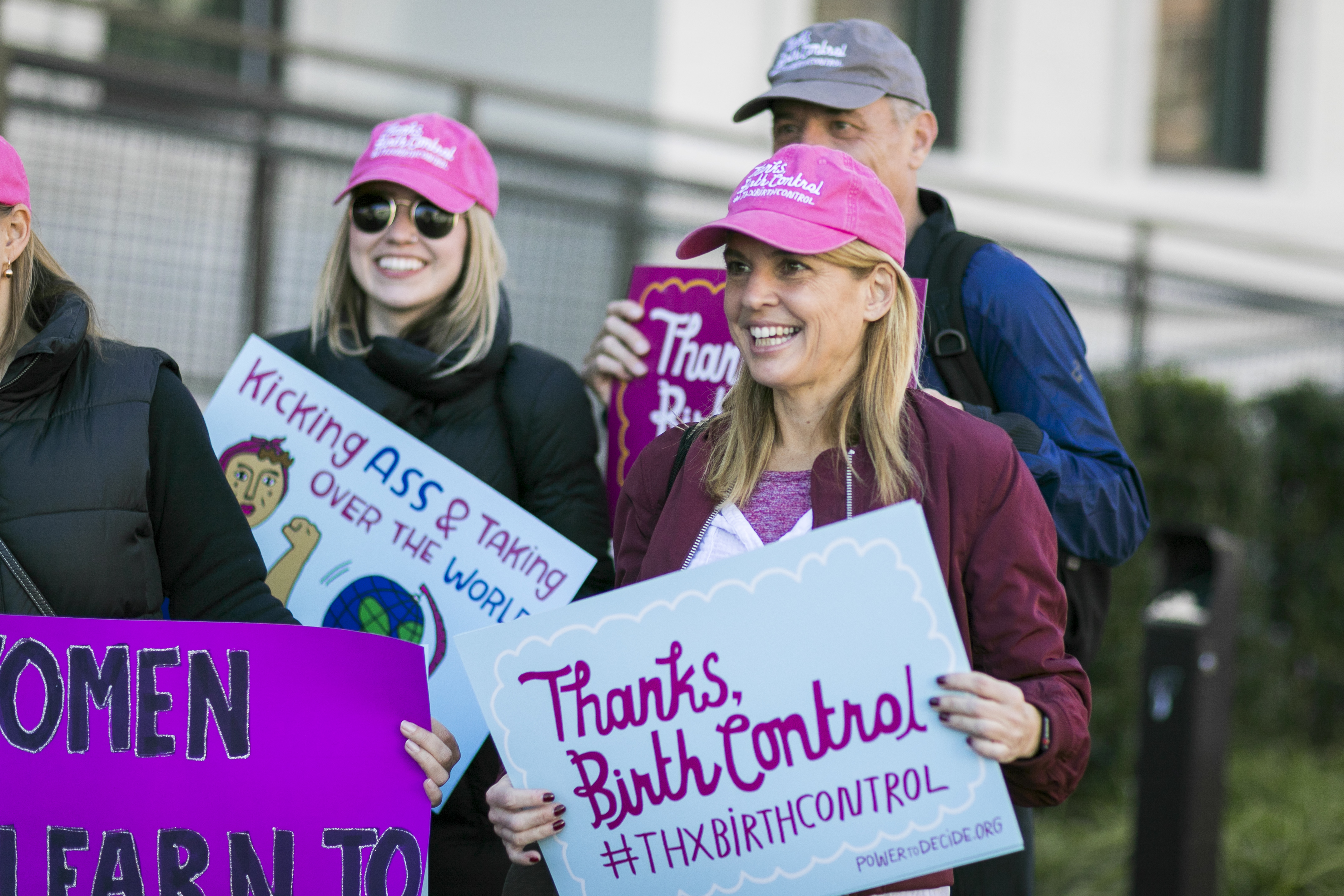Power to Decide CEO at a rally with a sign that reads, "Thanks, Birth Control #ThxBirthControl"
