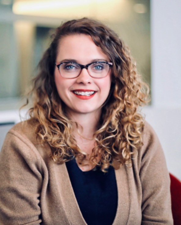 A professional headshot of Casey Roncoroni, VP of Development. 