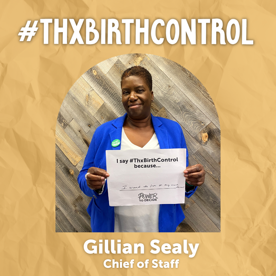 A Power to Decide Staffer holds a sign with their reason for saying #ThxBirthControl.