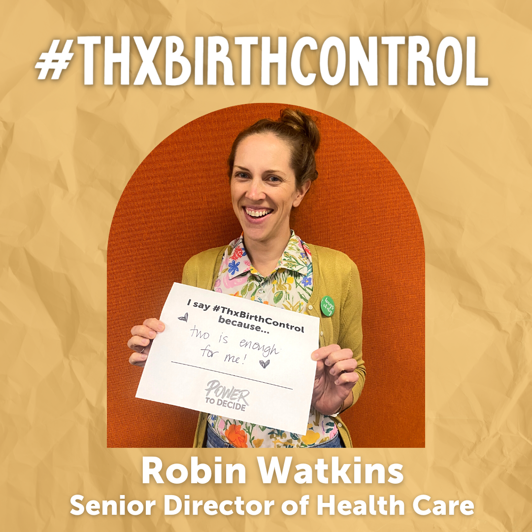 A Power to Decide Staffer holds a sign with their reason for saying #ThxBirthControl.