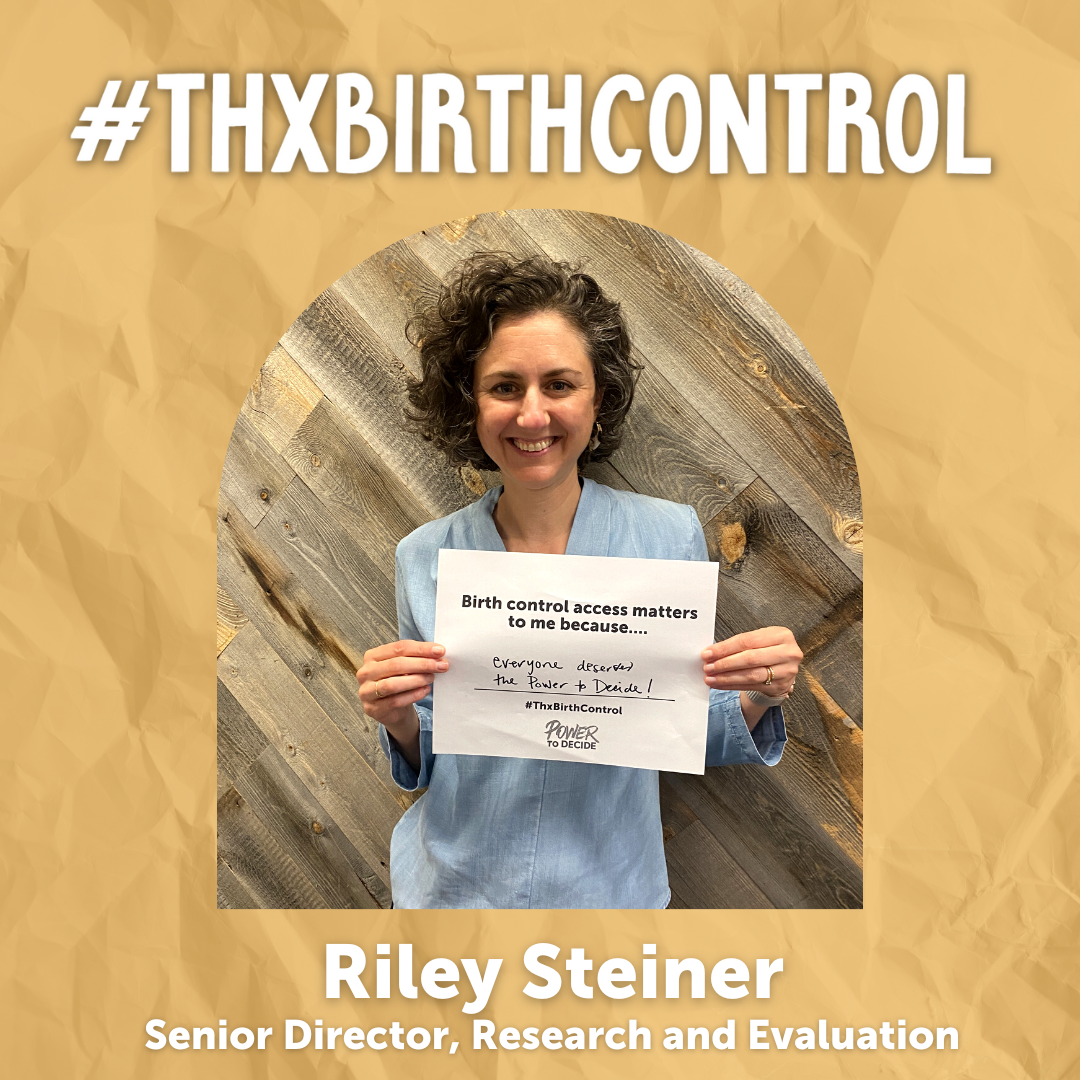 A Power to Decide Staffer holds a sign with their reason for saying #ThxBirthControl.