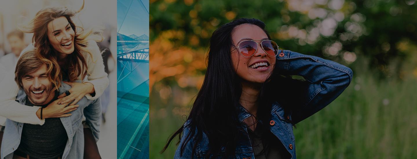 Man piggybacks his gf and another woman in shades smiles up at the sky