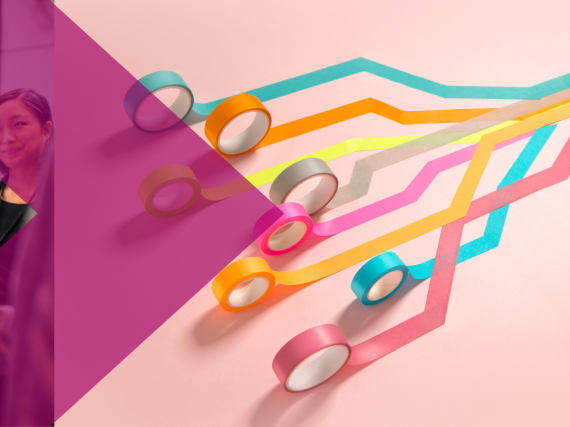 An image of people shaking hands at a business meeting next to an image of different  colors of tape rolling out towards a central point. 